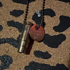 HALF UNITED FIGHTING HUNGER bullet necklace